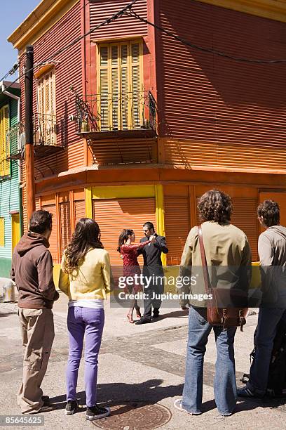 people watching dancers in street - la boca stock pictures, royalty-free photos & images