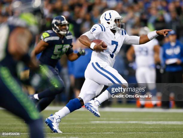 Jacoby Brissett of the Indianapolis Colts points as he rushes for 25 yards in the second quarter of the game against the Seattle Seahawks at...