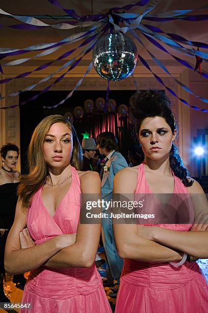 angry teenage girls wearing same dress at prom - mesma roupa imagens e fotografias de stock