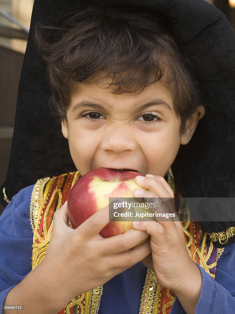 Boy eating apple