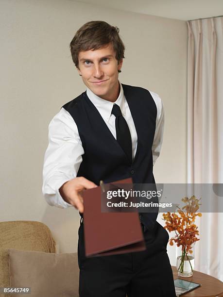 waiter presenting bill - ober stockfoto's en -beelden