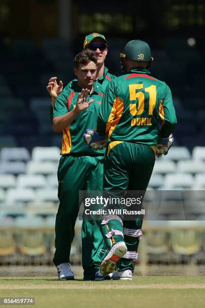 Cameron Boyce of the Tigers celebrates after taking the wicket of Daniel Hughes of the Blues during the One Day Cup match between New South Wales and...