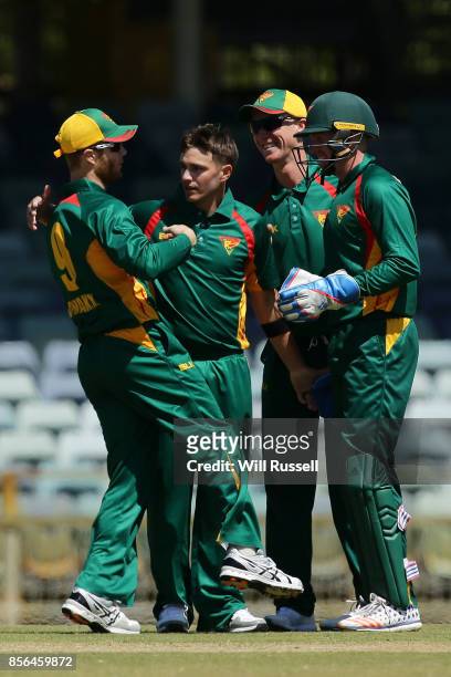 Cameron Boyce of the Tigers celebrates after taking the wicket of Daniel Hughes of the Blues during the One Day Cup match between New South Wales and...