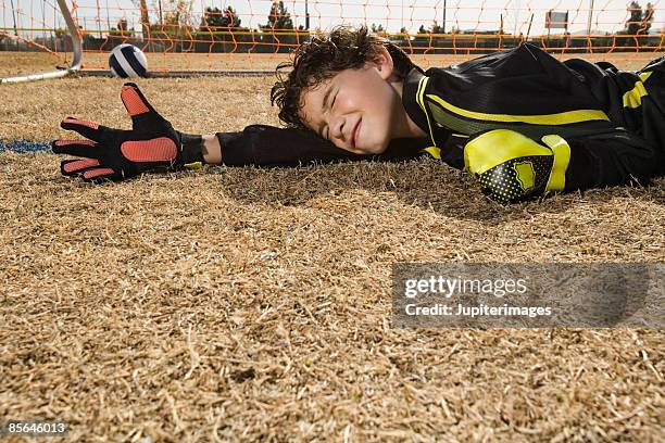 soccer goalie upset over missed block - bad goalkeeper stock pictures, royalty-free photos & images