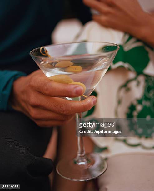 holding martini - wine glasses stock pictures, royalty-free photos & images