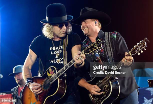 Recording artists Big Kenny and John Rich of Big & Rich perform during the Route 91 Harvest country music festival at the Las Vegas Village on...