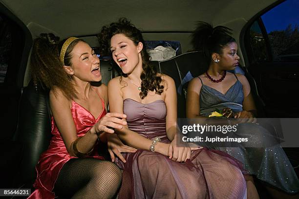 teenage girls sitting in limo - screaming happy in car stock-fotos und bilder