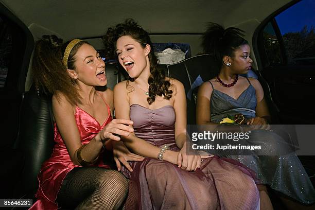 teenage girls sitting in limo - three people in car stock pictures, royalty-free photos & images