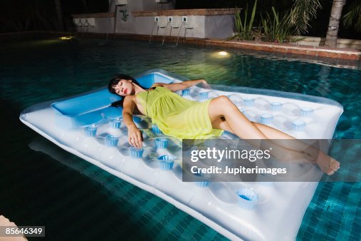 Woman In Inflatable Raft Woman On Inflatable Raft In Swimming Pool High-Res Stock Photo - Getty ...