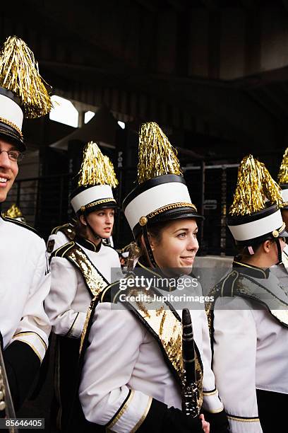 marching band members standing together - marching band stock pictures, royalty-free photos & images
