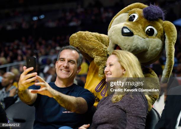 Eric Garcetti Mayor of Los Angeles and his wife Amy Wakeland take a selfie with Sparky during Game Four of WNBA Finals between the Los Angeles Sparks...