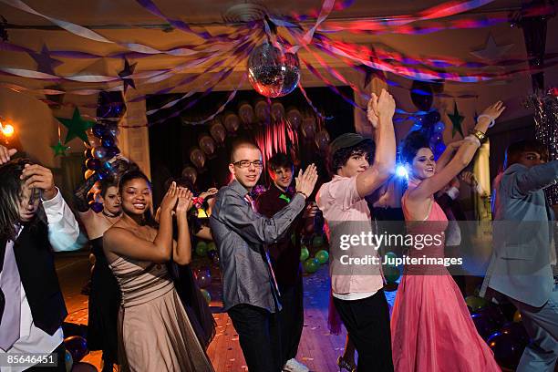 teenagers dancing together at prom - conga line dancing stock pictures, royalty-free photos & images