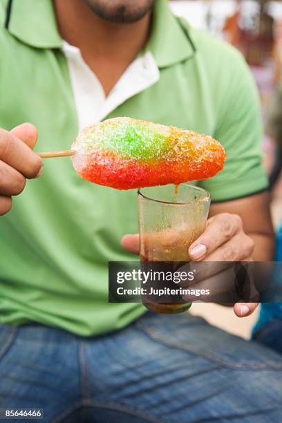 man with baraf gola - slush foto e immagini stock