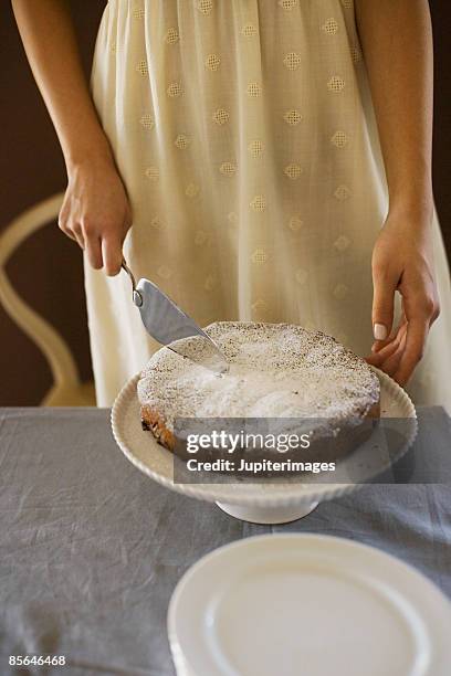 woman cutting cake - chocolate souffle stock pictures, royalty-free photos & images