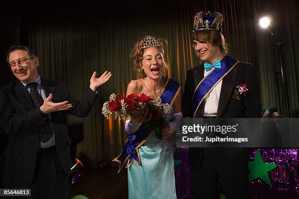 man announcing prom king and prom queen - sash stock pictures, royalty-free photos & images