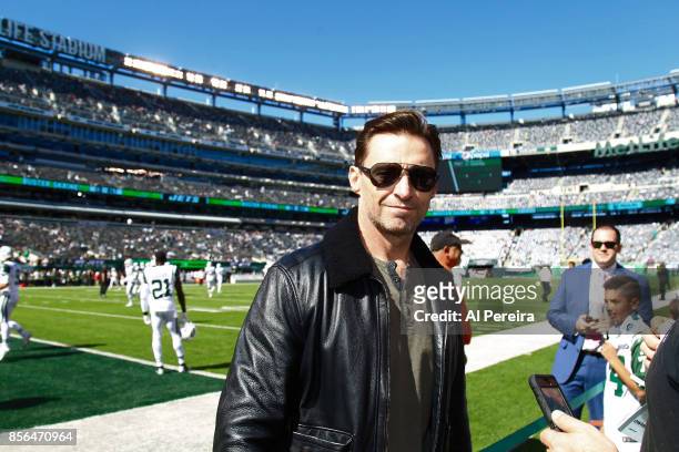 Hugh Jackman poses on the sideline when he attends the Jacksonville Jaguars vs New York Jets game at MetLife Stadium on October 1, 2017 in East...