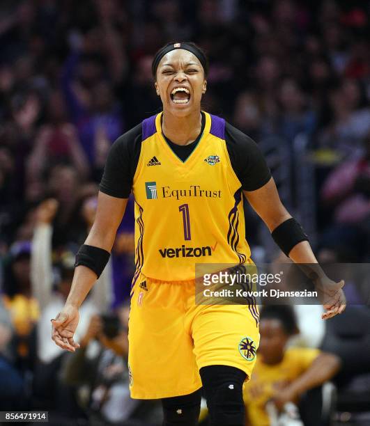 Odyssey Sims of the Los Angeles Sparks celebrates after scoring on a three point basket against Minnesota Lynx during Game Four of WNBA Finals at...