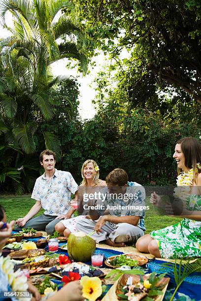 small group of people at hawaiian picnic - lei day hawaii stock-fotos und bilder