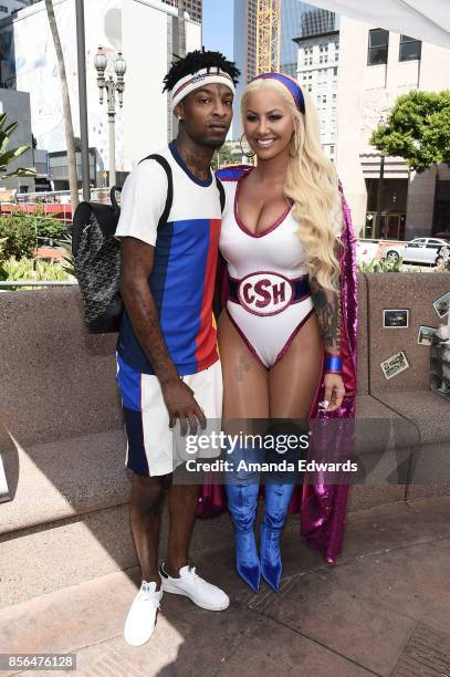 Model Amber Rose and rapper 21 Savage attend the 3rd Annual Amber Rose SlutWalk on October 1, 2017 in Los Angeles, California.