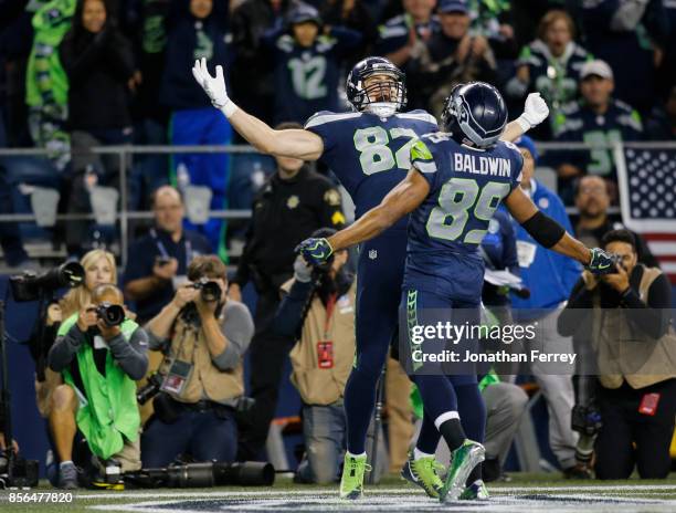 Tight end Luke Willson of the Seattle Seahawks celebrates his touchdown with wide receiver Doug Baldwin in the fourth quarter of the game at...