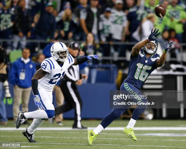 Wide receiver Tyler Lockett of the Seattle Seahawks makes a 41 yard reception against Vontae Davis of the Indianapolis Colts in the fourth quarter of...