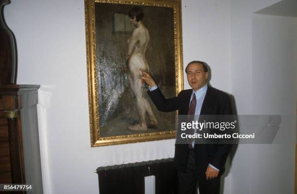 Silvio Berlusconi joking with a painting of a nude, Milan, Italy, 1985.