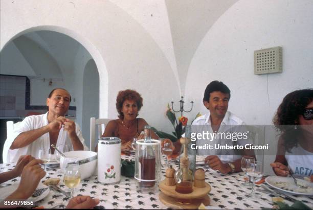 Hammamet, Tunisia, Silvio Berlusconi, Anna Craxi and Tarak Ben Ammar having lunch