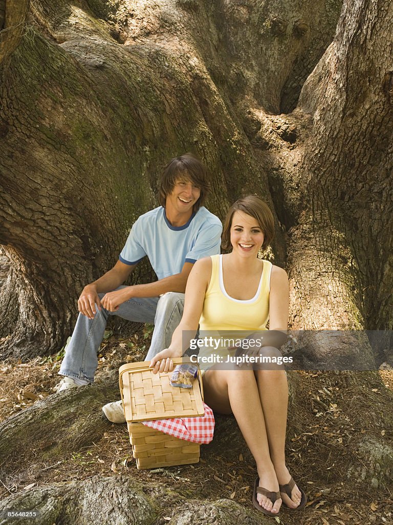 Young adult couple picnicking