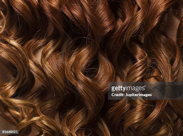 smooth curls of hair - beautiful redhead photos et images de collection