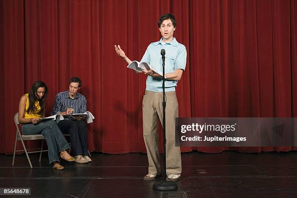 man speaking in front of microphone - actress audition stock pictures, royalty-free photos & images