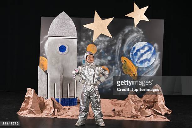 boy on stage dressed in astronaut costume - 学芸会 ストックフォトと画像