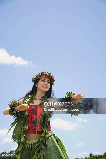 woman performing hula dance - hula dancing stock pictures, royalty-free photos & images
