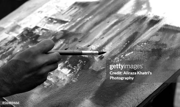 applying paint strokes abstract - acuarela en papel fotografías e imágenes de stock