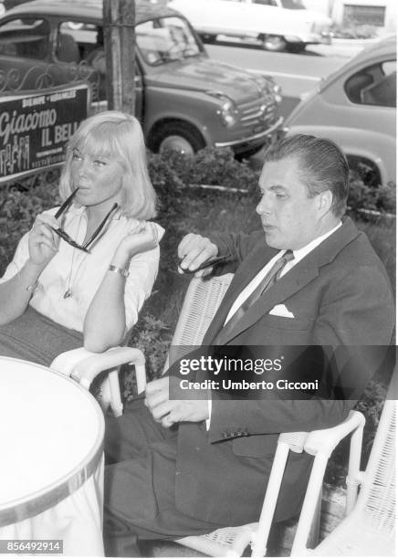 Swedish actress May Britt with actor John Mather in a cafe in Via Veneto, Rome in 1958.