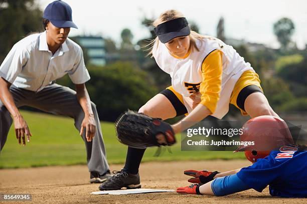 softball player sliding into base - second base stock pictures, royalty-free photos & images