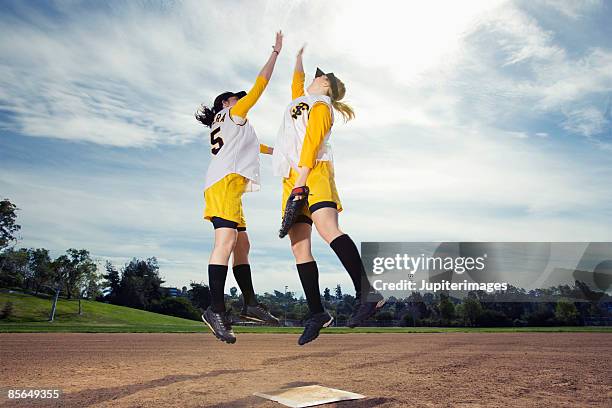 softball players celebrating - baseball strip fotografías e imágenes de stock