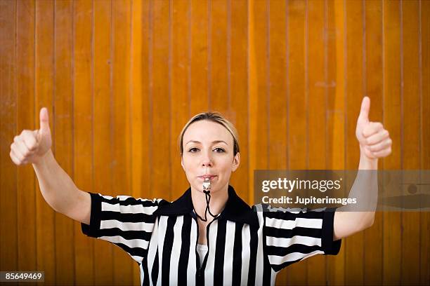 woman referee with whistle - schiedsrichter pfeife stock-fotos und bilder