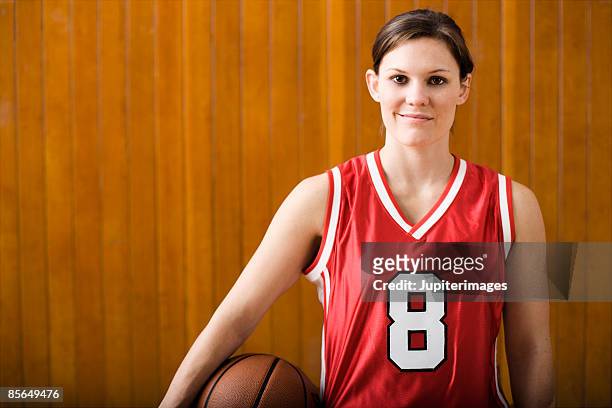 woman basketball player - basketball uniform stock pictures, royalty-free photos & images
