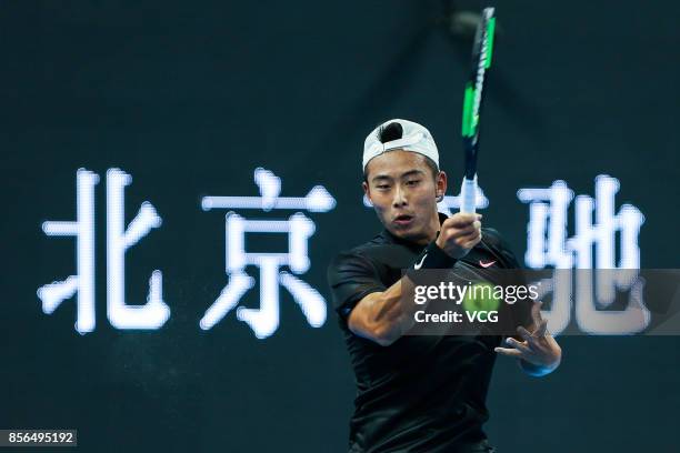 Zhang Ze of China returns a shot during the Men's singles first round match against Roberto Bautista Agut of Spain on day three of 2017 China Open on...