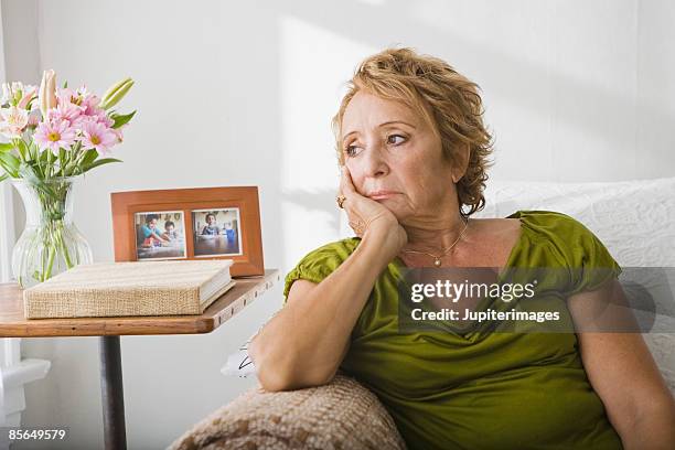 sad woman - man worried sitting stock-fotos und bilder