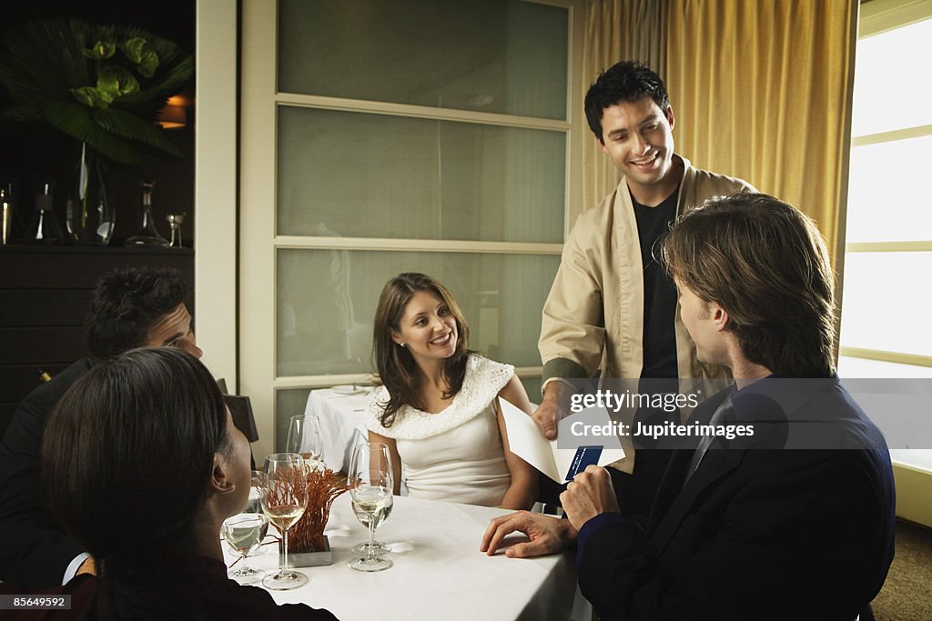 Man giving credit card to waiter
