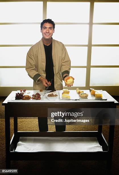 waiter with cheese assortment - serving cart stock pictures, royalty-free photos & images