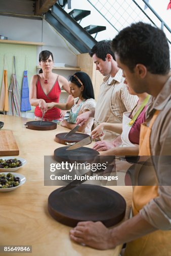 Woman teaching chopping technique Woman teaching chopping technique