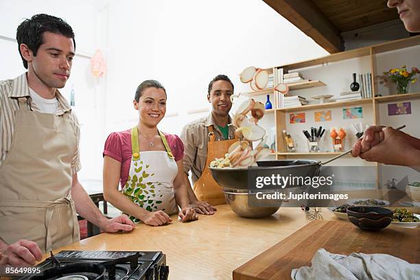 students watching tossing technique - saute pan stock pictures, royalty-free photos & images