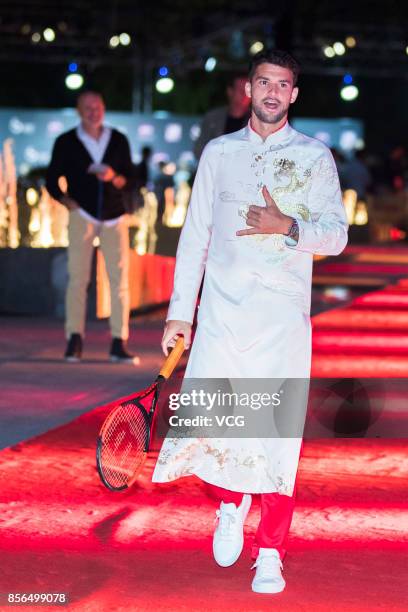 Grigor Dimitrov of Bulgaria walks on the red carpet of the 2017 China Open Player Party at Beijing Olympic Tower on October 1, 2017 in Beijing, China.