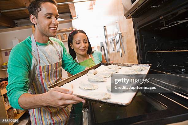 couple cooking stuffed pastries - indian food bildbanksfoton och bilder