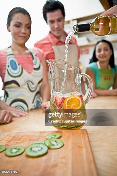 adults watching drink preparation - sangria stock pictures, royalty-free photos & images