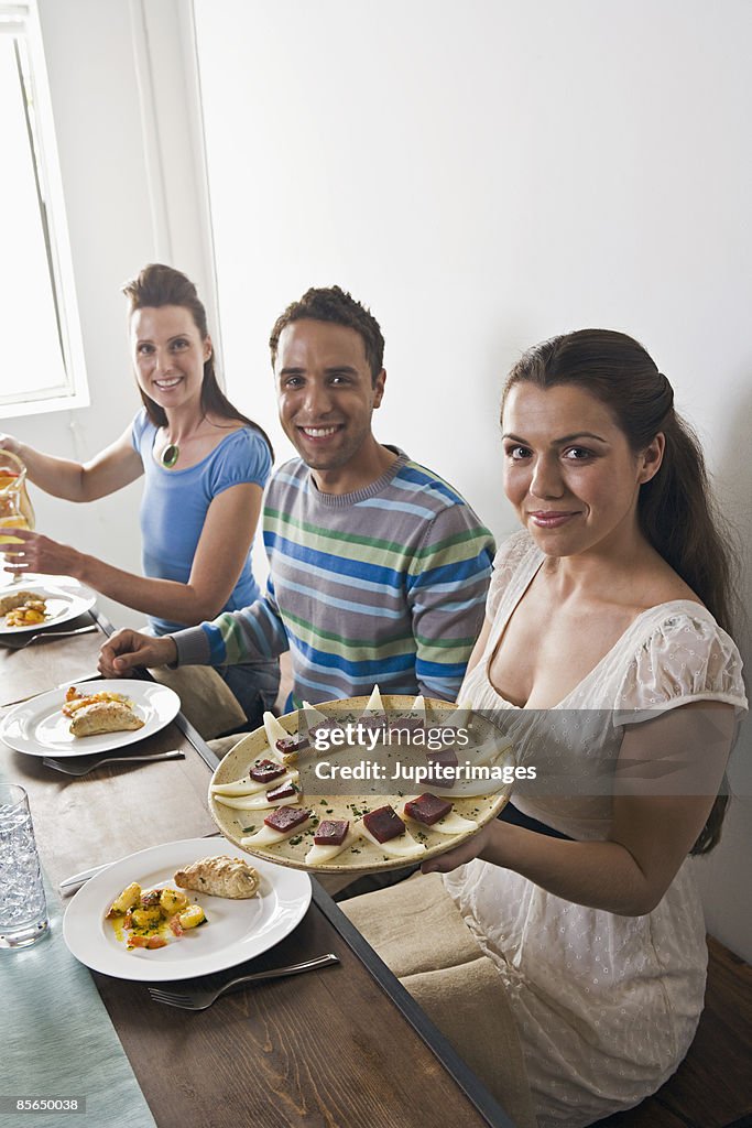 Mid-adults with tapas at table
