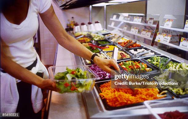 woman making a salad - salad to go stock pictures, royalty-free photos & images