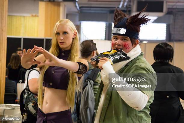 Couple dressed as manga characters are pictured during the 24th edition of the Paris Manga Sci-Fi Show mostly devoted to Japanese entertainment and...